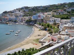 a view of a beach with boats in the water at L'Isolana Case Vacanza Palma 1 in Ponza