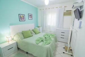 Cama ou camas em um quarto em Pousada Irashai