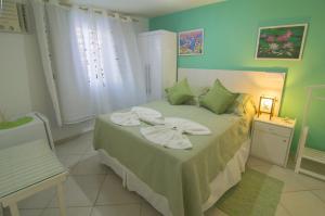 Cama ou camas em um quarto em Pousada Irashai