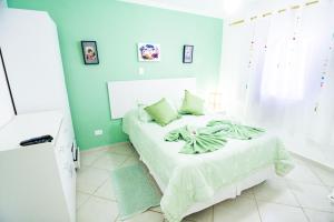 Cama ou camas em um quarto em Pousada Irashai