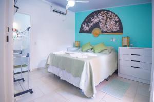 Cama ou camas em um quarto em Pousada Irashai