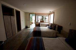 Postel nebo postele na pokoji v ubytování Hotel Helverica