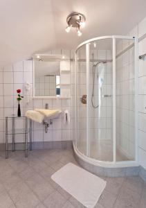 a large bathroom with a shower and a sink at Pension Panoramablick in Pfarrkirchen im Mühlkreis