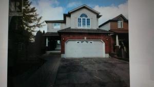 a large house with a white garage door at HB Guest Home 5 in Waterloo