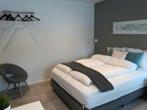 Ένα ή περισσότερα κρεβάτια σε δωμάτιο στο Post-Plaza Guesthouse