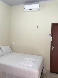 Postel nebo postele na pokoji v ubytování Pousada Pouso Vitoria