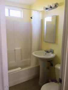 A bathroom at Europa Inn & Suites