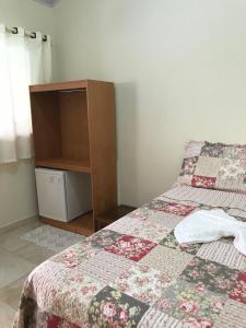 Postel nebo postele na pokoji v ubytování Pousada Pouso Vitoria