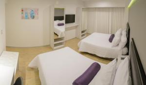Posteľ alebo postele v izbe v ubytovaní Awqa Hoteles - Sede Natasha