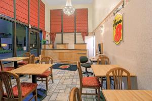 a fast food restaurant with tables and chairs at Super 8 by Wyndham Yreka in Yreka