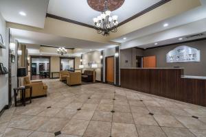 a lobby of a hotel with a waiting room at Wingate by Wyndham Bowling Green in Bowling Green