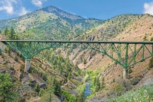 a bridge over a river in the mountains at Super 8 by Wyndham Yreka in Yreka