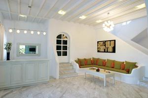 a living room with a couch and a table at Zephyros in Paraga