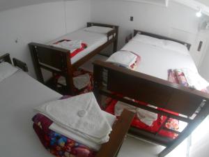 Cama o camas de una habitación en Nomada Hostel