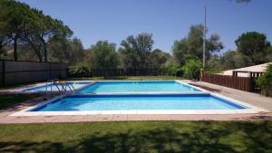 a swimming pool in the backyard of a house at Amfibietreks in Siniscola