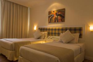 Postel nebo postele na pokoji v ubytování The Jerai Hotel Alor Star + 37 fotografií