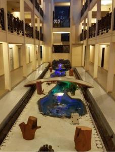 a large room with a pool in the middle of a building at Hotel Seri Malaysia Kuantan in Kuantan