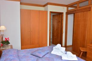 Posteľ alebo postele v izbe v ubytovaní Ski Residence