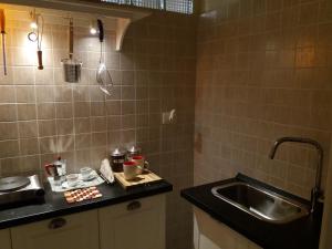 a kitchen with a sink and a counter top at Il Da Vinci casa vacanze in Giovinazzo