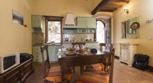 a kitchen with a table with food on it at Casa Bandino in Campiglia dʼOrcia