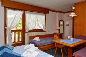Säng eller sängar i ett rum på Ski Residence