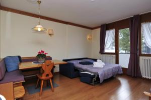 Posteľ alebo postele v izbe v ubytovaní Ski Residence