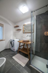 a bathroom with a sink and a shower at La dimora nel Castello in Collevalenza