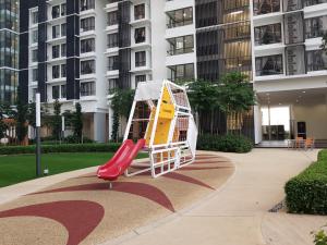 a playground in a building with a slide at Eclipse Residence Pangea in Cyberjaya