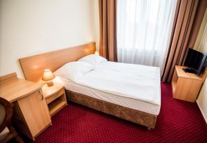 Posteľ alebo postele v izbe v ubytovaní Hotel Piast