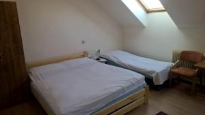 Postel nebo postele na pokoji v ubytování Rekreačný dom Ruža