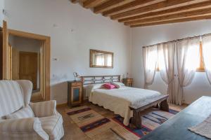 Ein Bett oder Betten in einem Zimmer der Unterkunft La Casa di Campagna