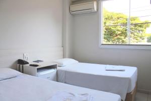 Postel nebo postele na pokoji v ubytování MFG Hotel