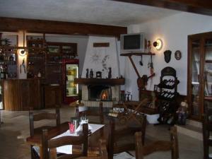 a living room filled with furniture and a fireplace at Rahoff hotel in Bansko
