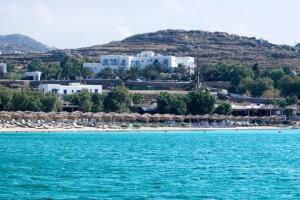 a view of a beach with umbrellas and a resort at Zephyros in Paraga