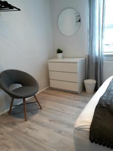 Ένα ή περισσότερα κρεβάτια σε δωμάτιο στο Post-Plaza Guesthouse
