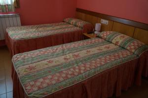 Posteľ alebo postele v izbe v ubytovaní Hostal Camino Real