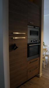 Kuchyň nebo kuchyňský kout v ubytování Apartamenty Legionów