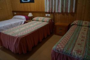 Posteľ alebo postele v izbe v ubytovaní Hostal Camino Real