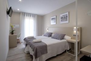Postel nebo postele na pokoji v ubytování Casa O Real