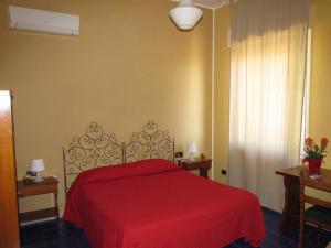 Łóżko lub łóżka w pokoju w obiekcie Hotel Panorama di Sicilia
