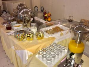a table with a bunch of food on it at Sailor's Nautical Concept in Spetses