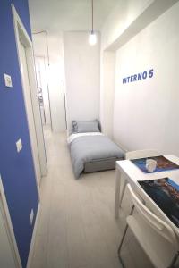 A bed or beds in a room at Interno5 Apartment