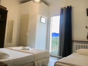Postel nebo postele na pokoji v ubytování Hotel Le Centre