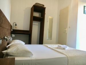 Postel nebo postele na pokoji v ubytování Hotel Le Centre