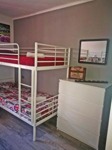A bed or beds in a room at nada