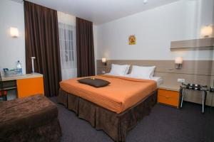 Ein Bett oder Betten in einem Zimmer der Unterkunft Villa Lana Hotel