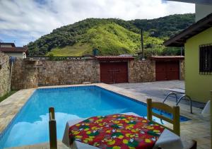 The swimming pool at or close to Ipê Suites Juquehy