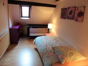 En eller flere senge i et værelse på La maison Céline