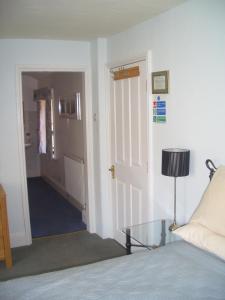 A bed or beds in a room at Big Sky Guest House- ROOM ONLY 