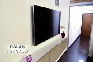 a flat screen tv on a wall in a living room at Domus Paradiso City Center in Rome